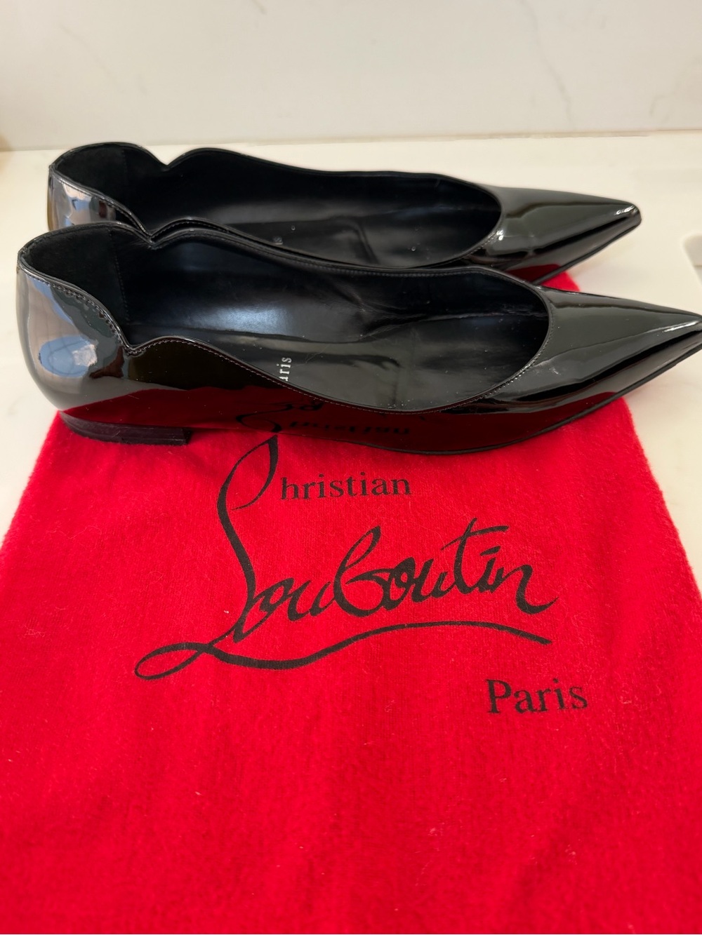 Christian Louboutin Black Patent Leather Chickita flats.